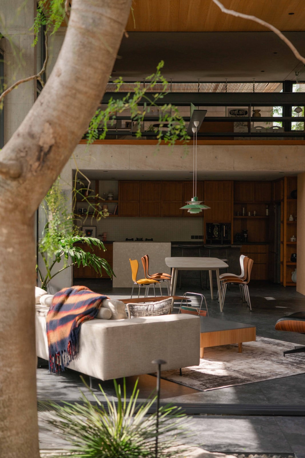 The kitchen and dining area below the mezzanine level provides a more intimate scale