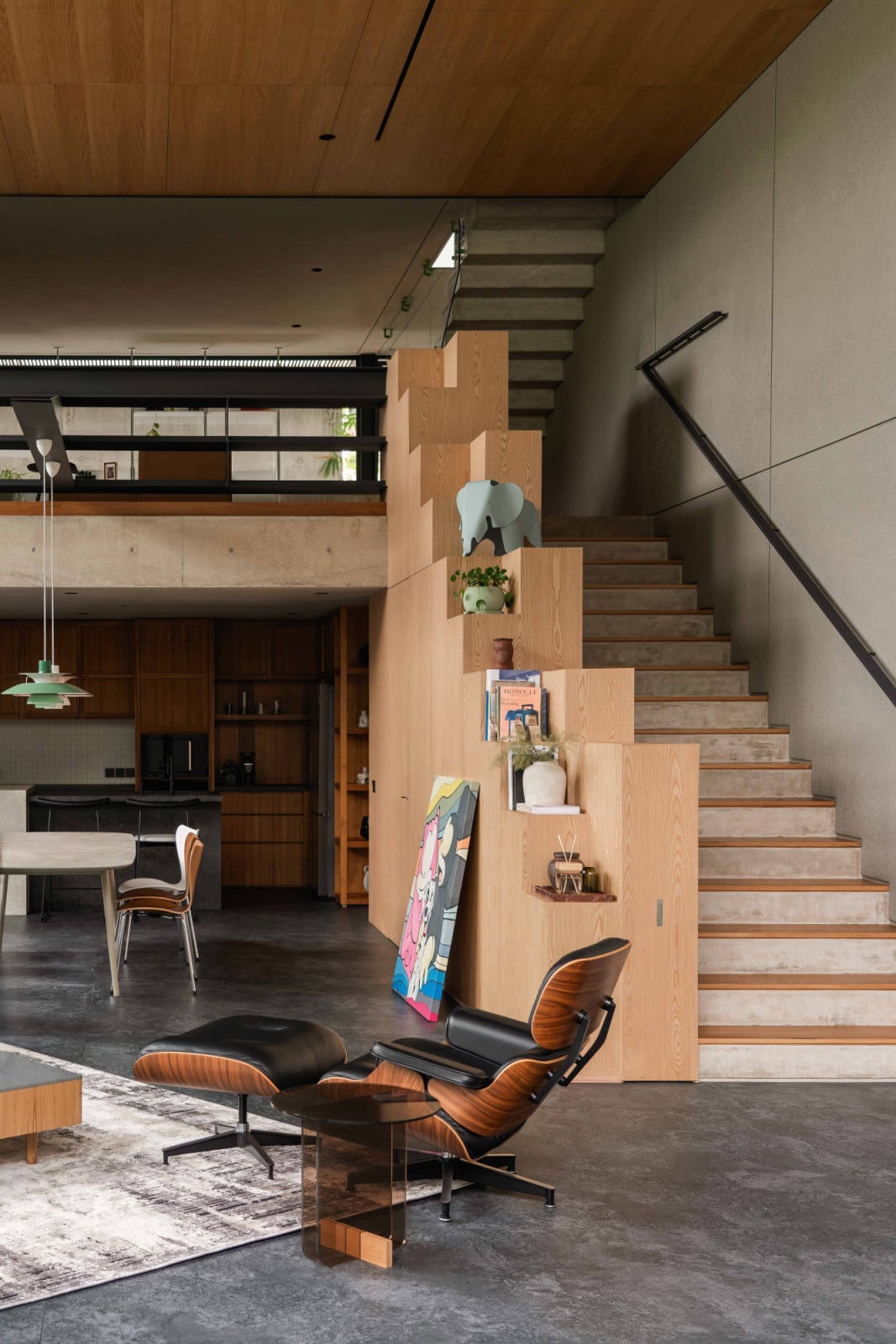 These display steps hold books, plants and artworks that speak of the occupants’ shared life