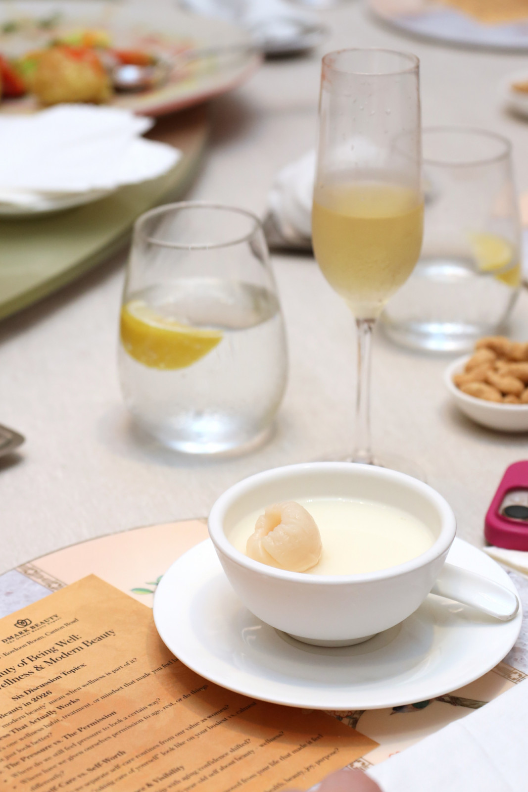 A lychee dessert and champagne served at DMARK BEAUTY's 'Beauty of Being Well: Wellness & Modern Beauty' event.