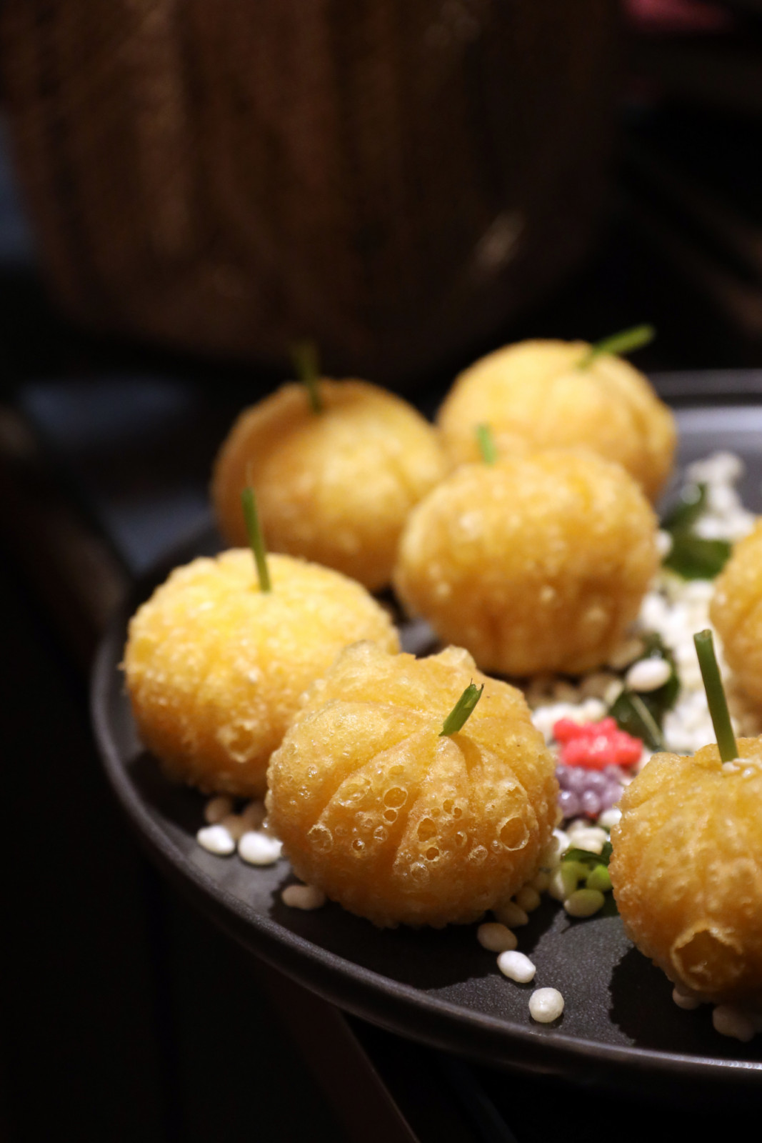 Golden, intricately crafted pumpkin-shaped delicacies, presented as a beautiful culinary delight.