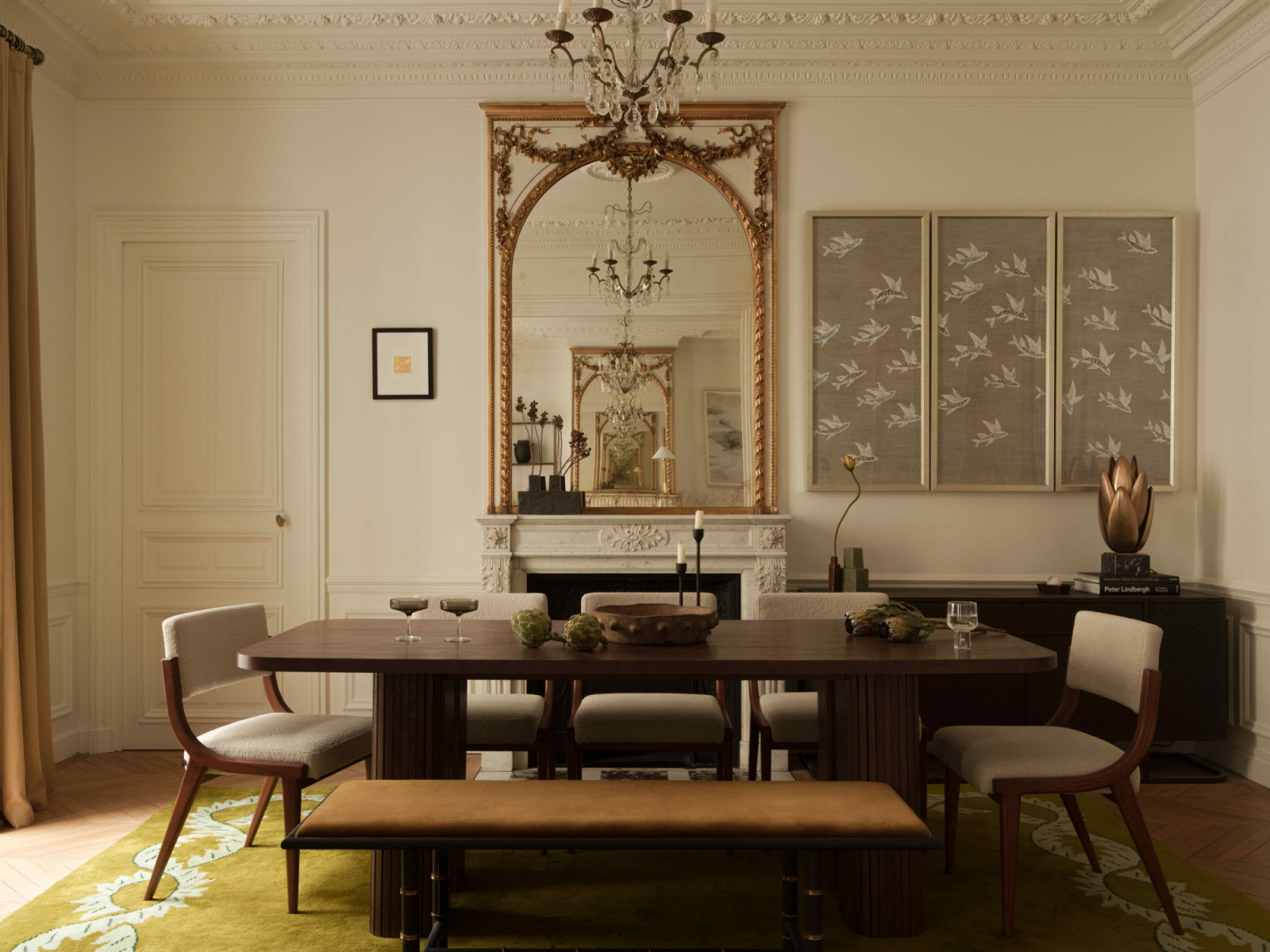 The dining area, featuring a La Redoute Interieurs dining table, Liang & Eimil dining chairs, and a Julian Chichester bench with upholstery by Mark Alexander