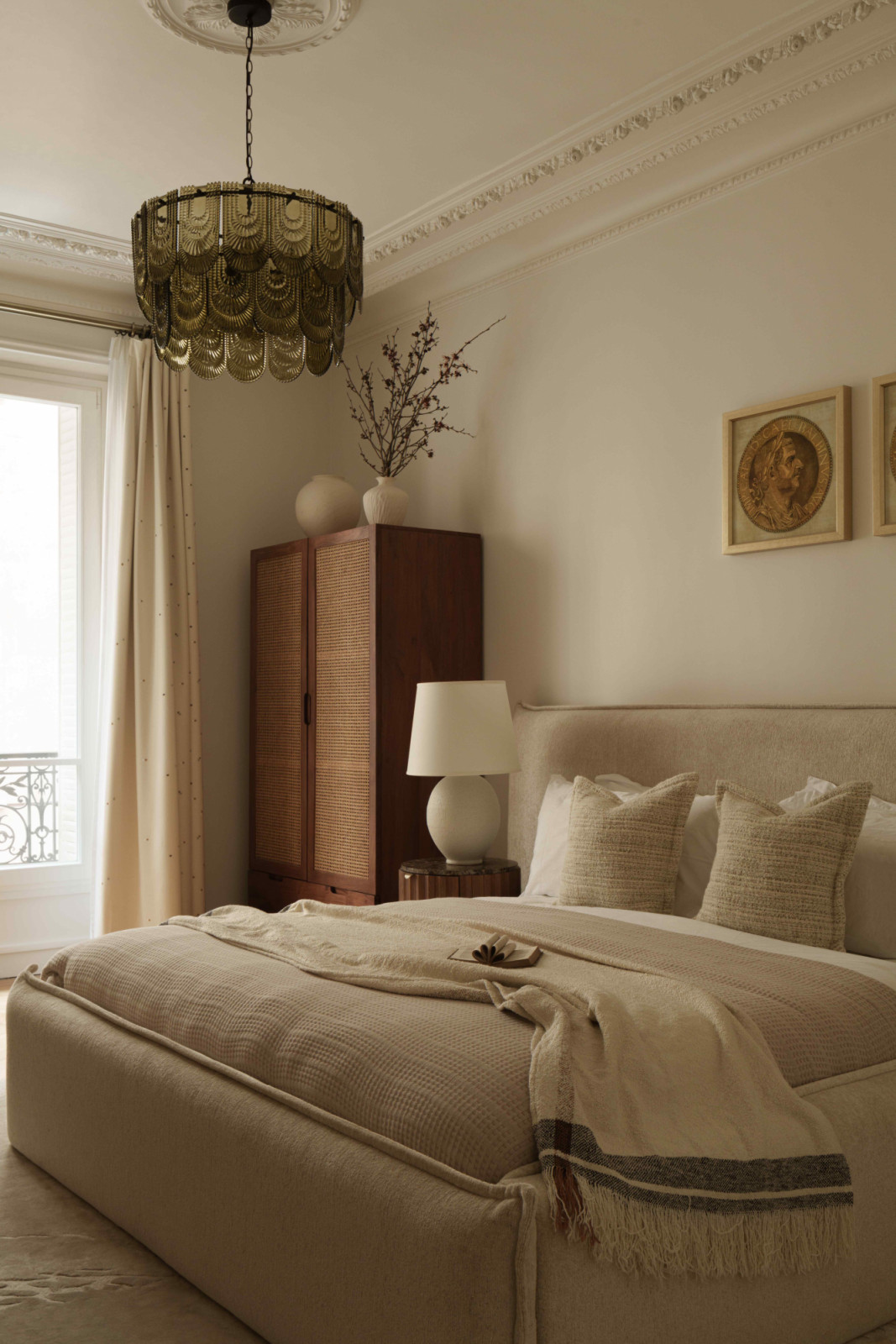 Wood and rattan elements bring natural warmth into the guest bedroom