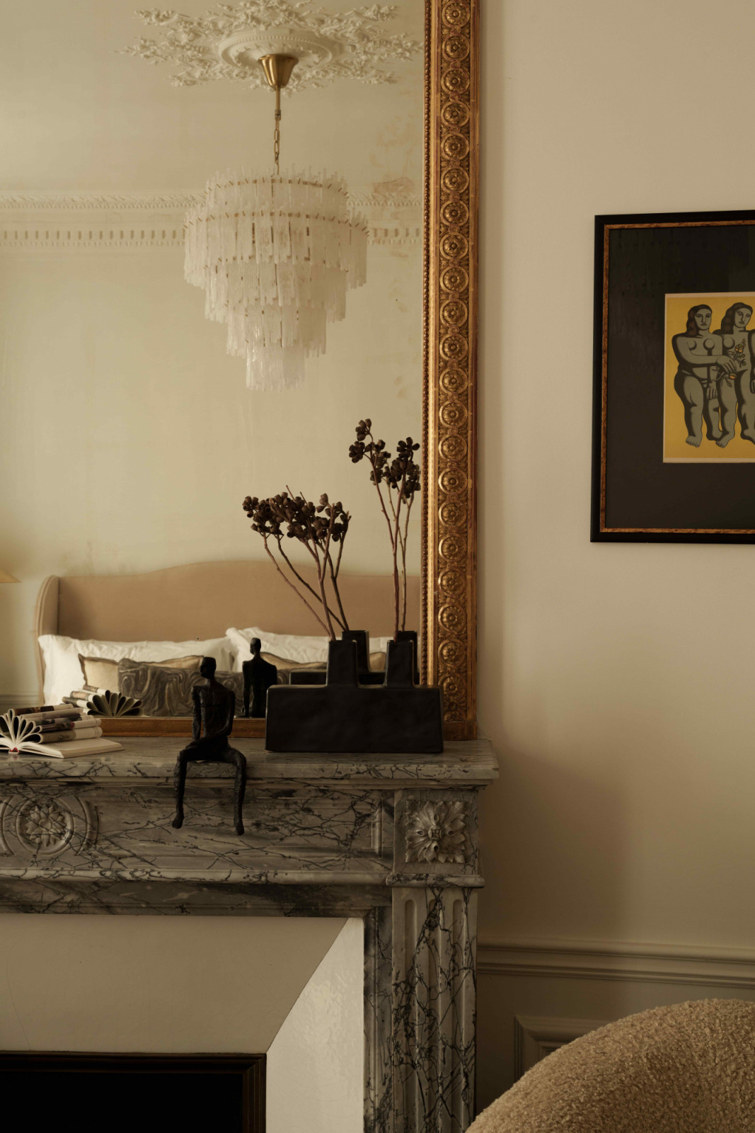 The Frieze chandelier by Pure White Lines hangs above the room