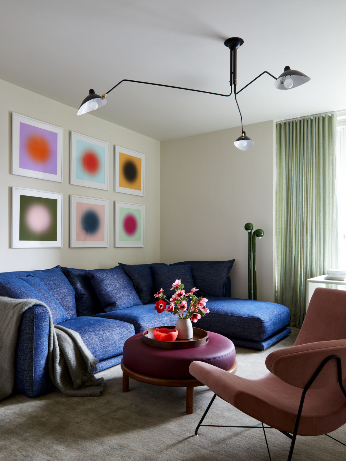 The vibrant den of a family's New York City apartment by Rachel Sloane Interiors