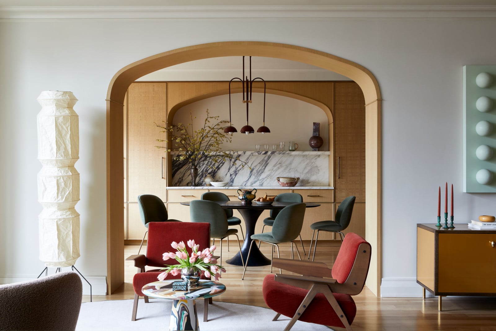 The living room and dining area of a family's New York City apartment by Rachel Sloane Interiors