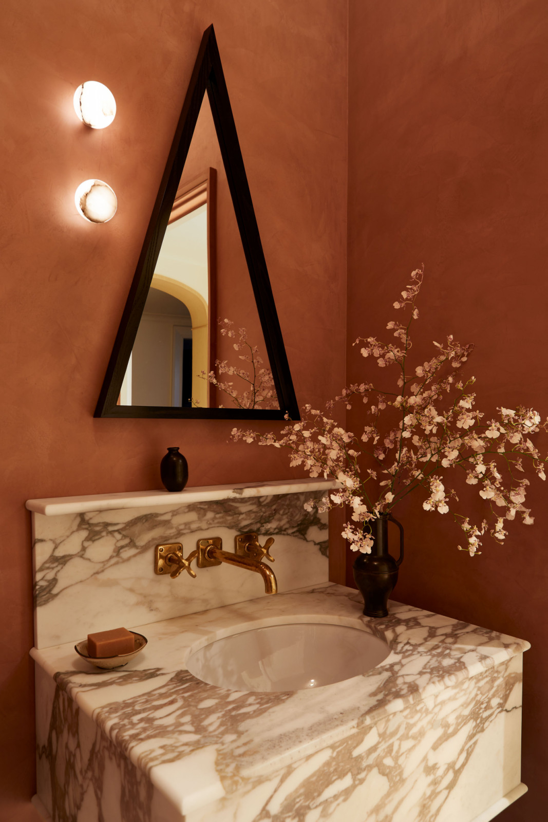 The powder room of a family's New York City apartment by Rachel Sloane Interiors