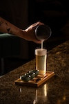 Calm, a non-alcholic beverage composed of coconut water jasmine
soda, honey and almond foam
