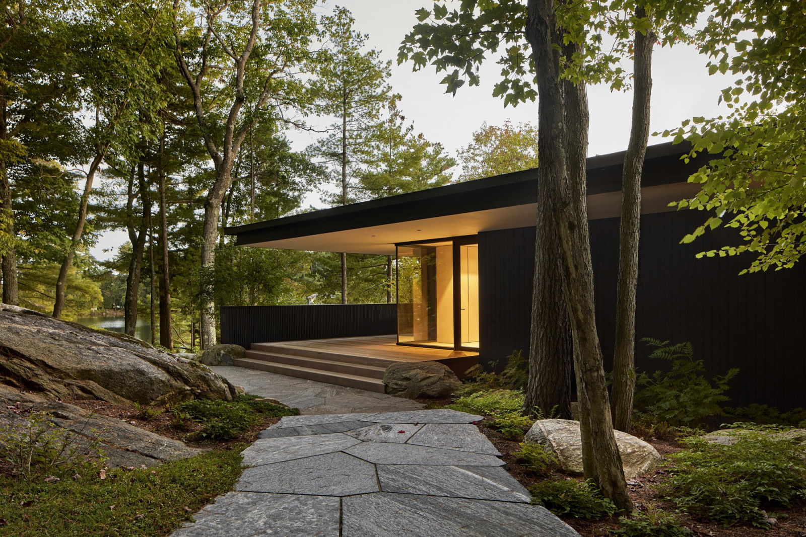 The double-storey residence unfolds as a series of planar elements