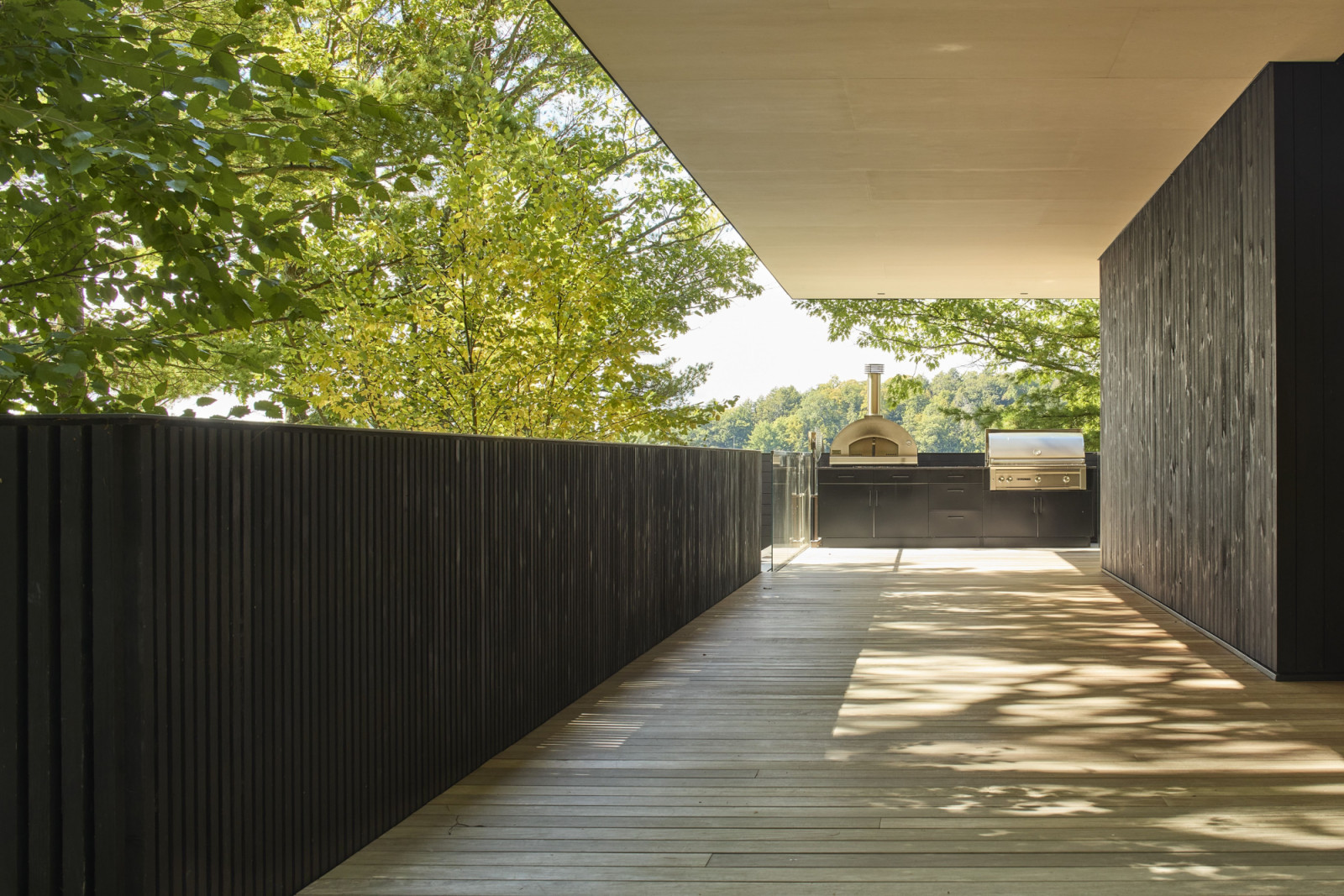The generous outdoor deck leads to an initial view of the lake from an elevated vantage point
