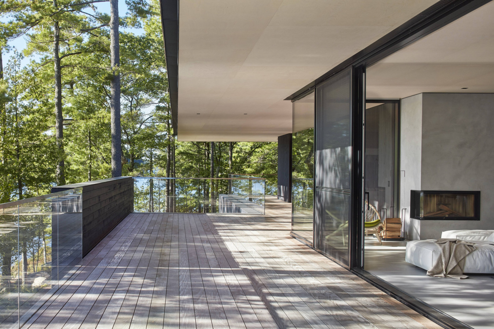 Floor-to-ceiling glazings open the interiors into nature
