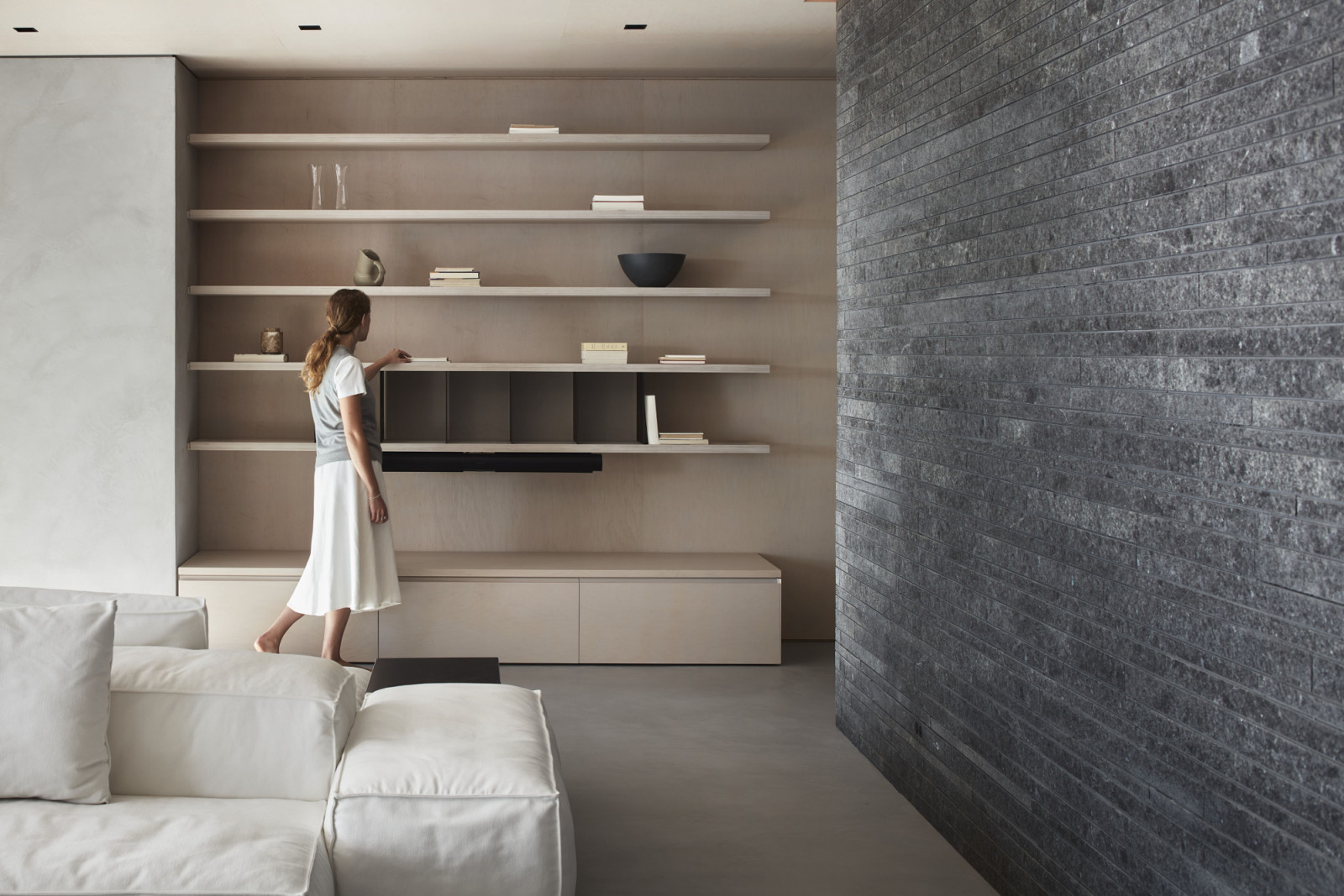 The interior revolves around a central black granite feature wall, sourced from neighbouring Quebec