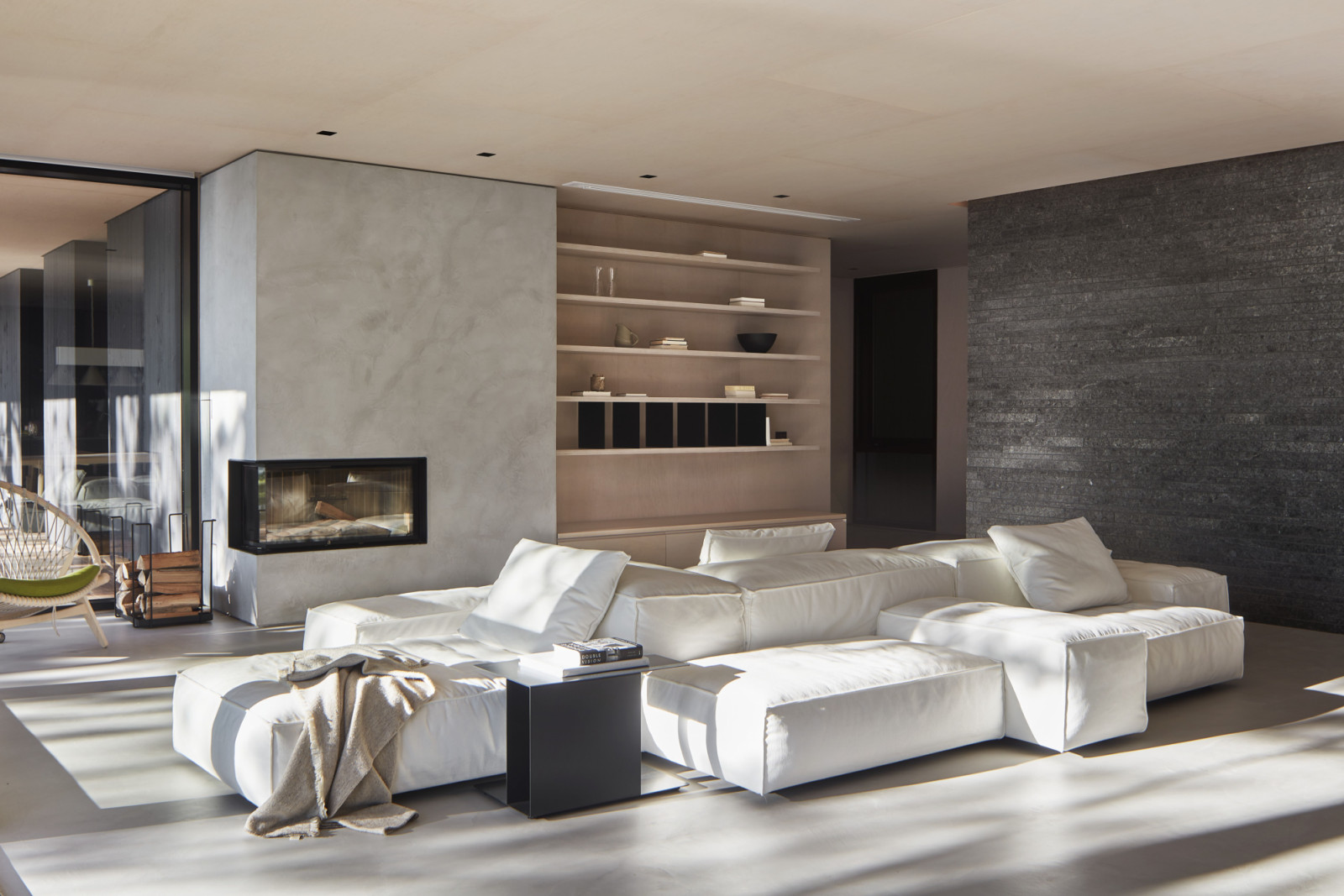The modest palette of wood, concrete, metal and stone is elevated through discreet, precisely detailed interventions