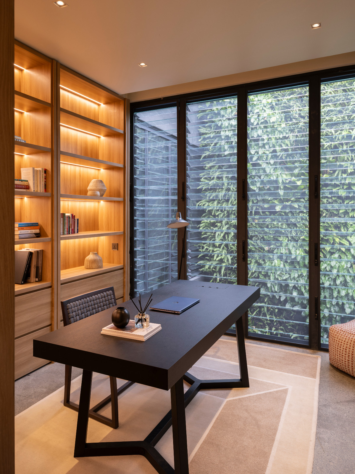 The home office has tranquil views of nature as it changes throughout the day