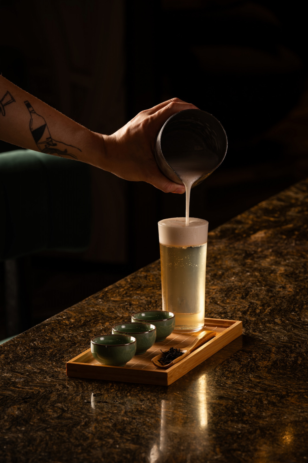 Calm, a non-alcholic beverage composed of coconut water jasmine soda, honey and almond foam