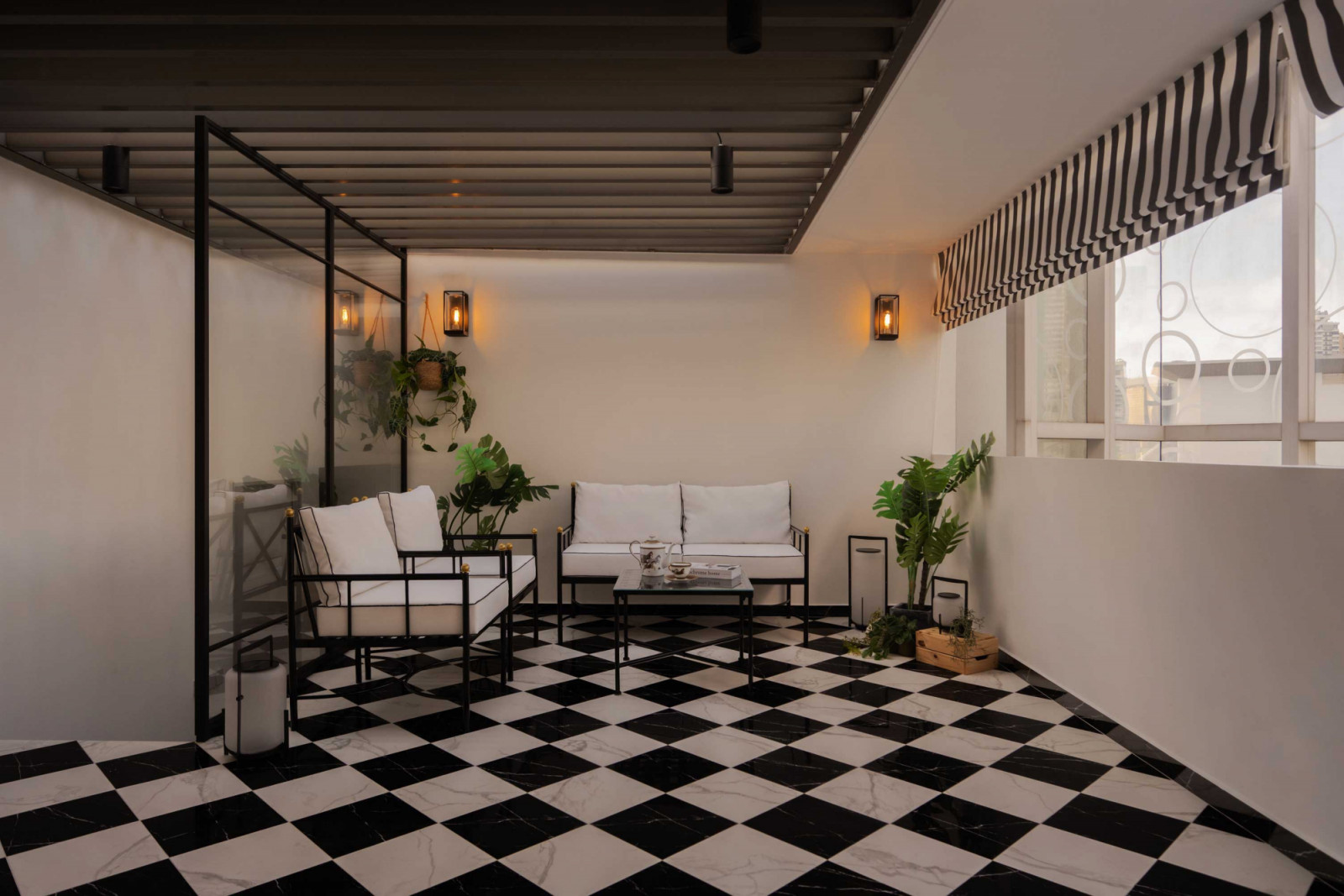 This seating area on the home’s attic level also channels the Jazz Age with its prominent chequerboard tilework