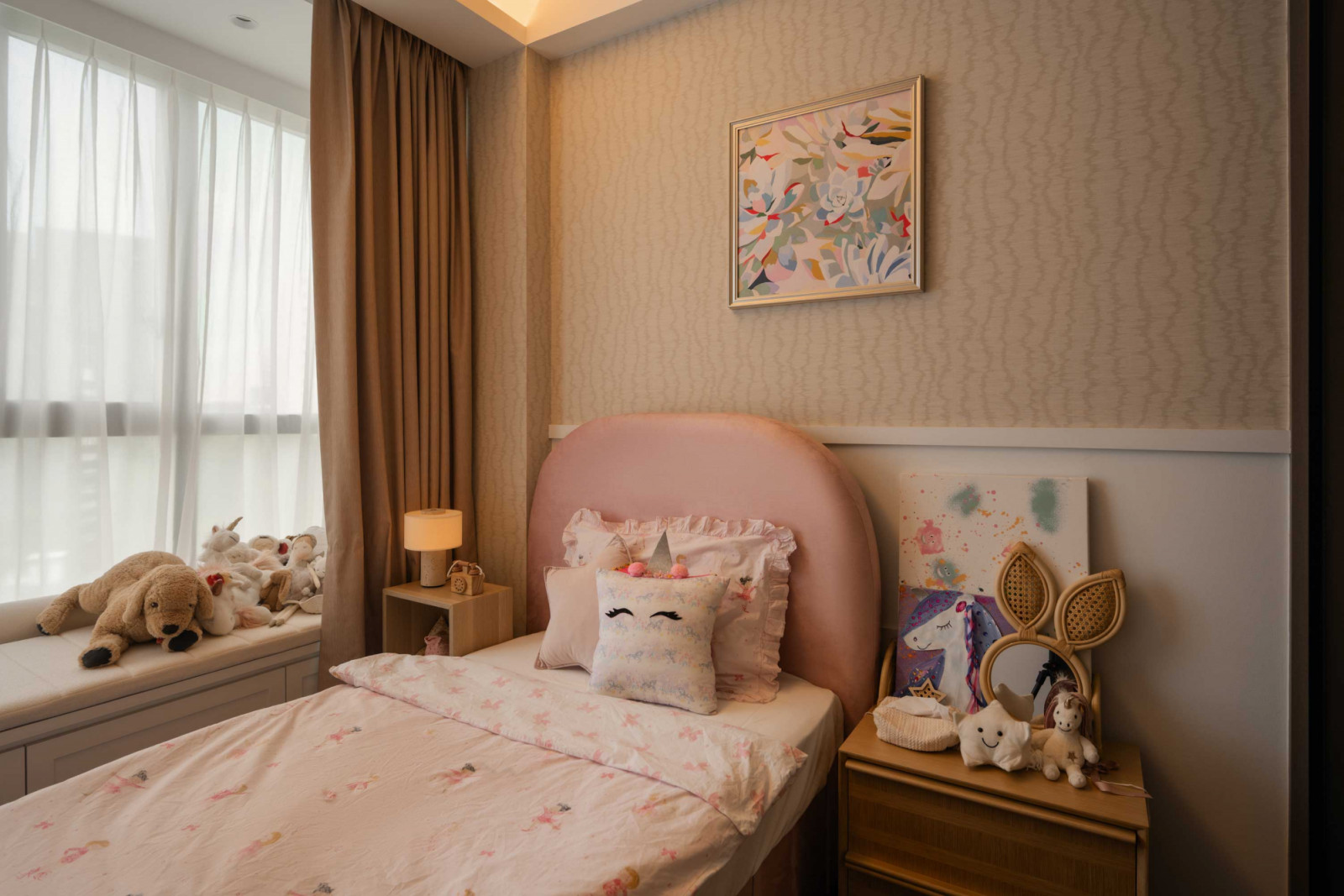 While the daughter's room leans pink and is graced by mythical unicorns