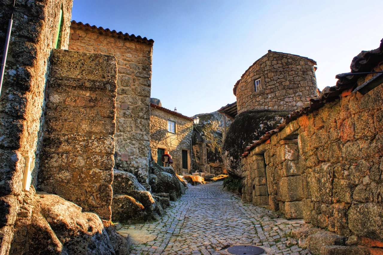A cobbled street in Monsanto, Portugal, where houses have been built directly around the village’s granite boulders since the Middle Ages (Photo: iStock)