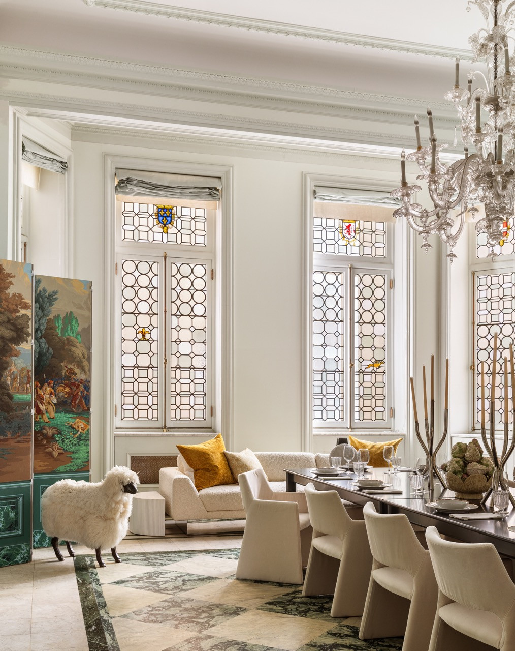 Another view of the Dining Room, with a taxidermy sheep standing beside a painted folding screen