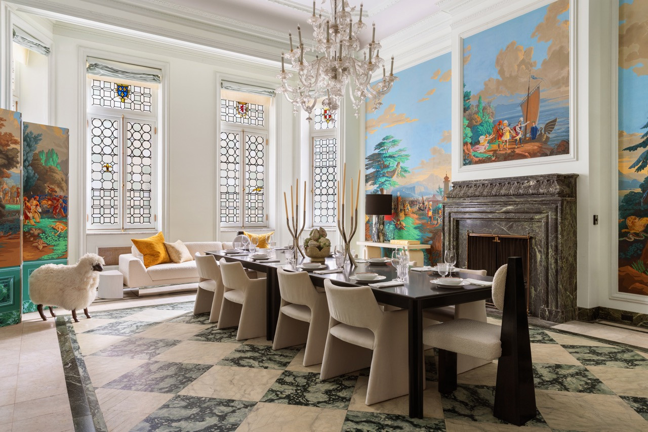 The Dining Room in full, its long table set beneath a Murano chandelier and hand-painted mural panels