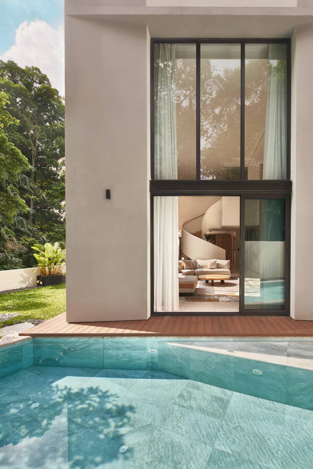 Just outside Aurum Land CEO home’s living room is a lap pool, which is a hub for family get-togethers on the weekends