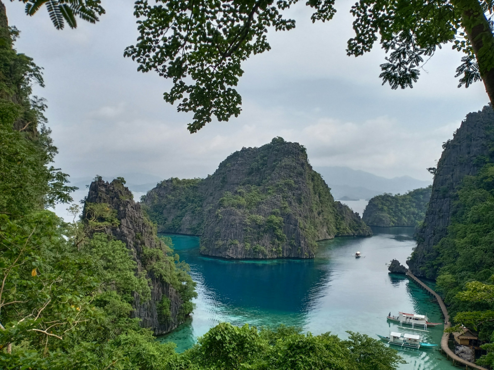 Kayangan Lake in Coron, Palawan, features crystal-clear waters embraced by towering limestone karsts.