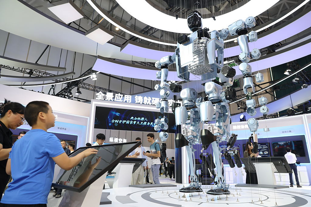 BEIJING, CHINA - AUGUST 19: A visitor learn about components of humanoid robot during 2026 World Robot Conference at Beijing E-Town on August 19, 2026 in Beijing, China. Themed "Human-Robot Symbiosis, Production-Demand Convergence," the 2026 edition of the conference kicked off in Beijing on August 19. (Photo by Wang Ziru/China News Service/VCG via Getty Images)