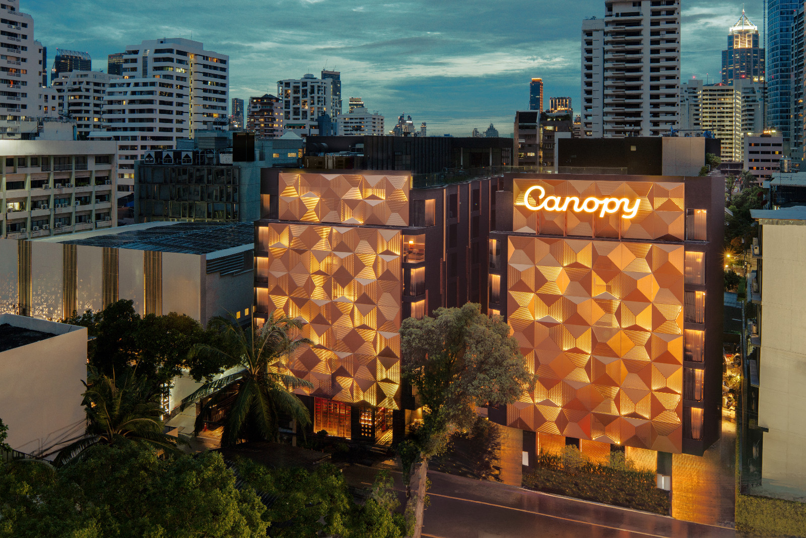 The bronze architectural façade is inspired by vintage film cameras from the nearby historic Sri Krung Sound Film Studio. (Photo: Canopy Bangkok Sukhumvit)