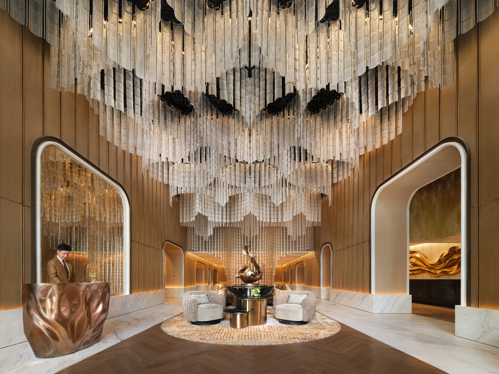 The hotel’s lobby features a glass chandelier inspired by Thailand’s national golden ratchaphruek blossom. (Photo: Fairmont Bangkok Sukhumvit)