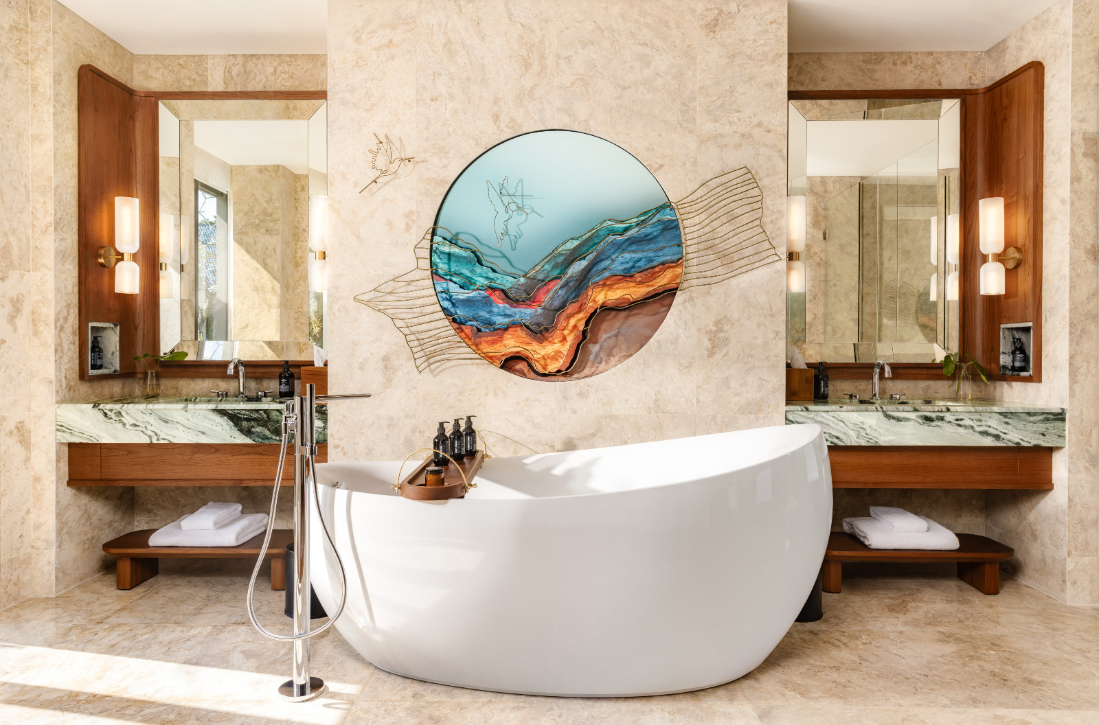 Designed by Denton Corker Marshall, en-suite bathrooms pair natural stone finishes with clean lines. (Kimpton Suntaya Bali Ubud)