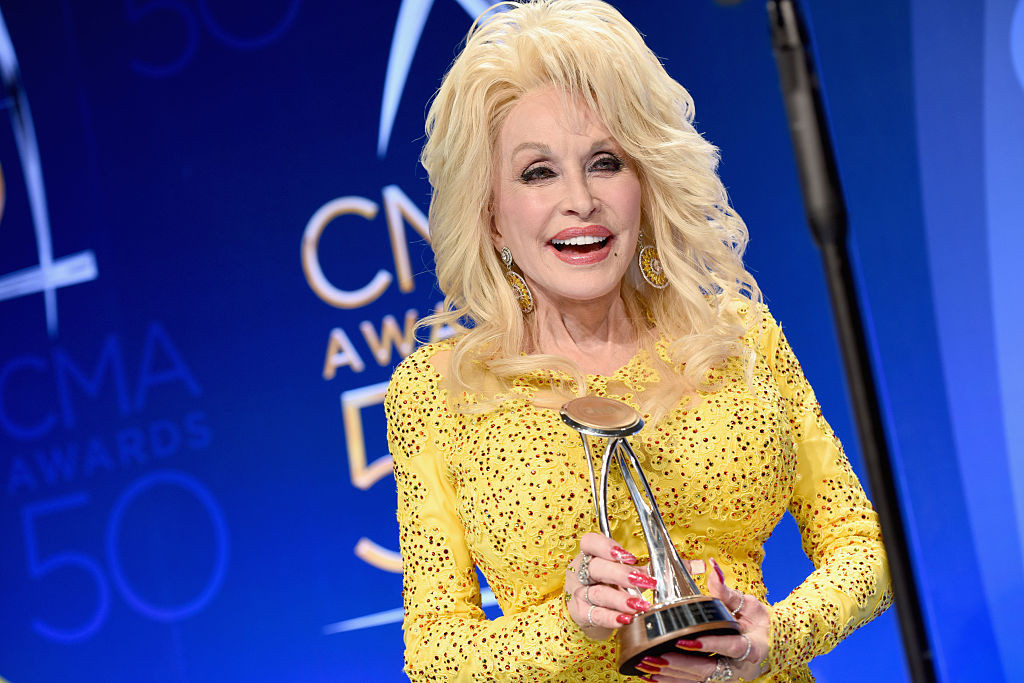 NASHVILLE, TN - NOVEMBER 02: Dolly Parton poses with award backstage during the 50th annual CMA Awards at the Bridgestone Arena on November 2, 2016 in Nashville, Tennessee. (Photo by John Shearer/WireImage)