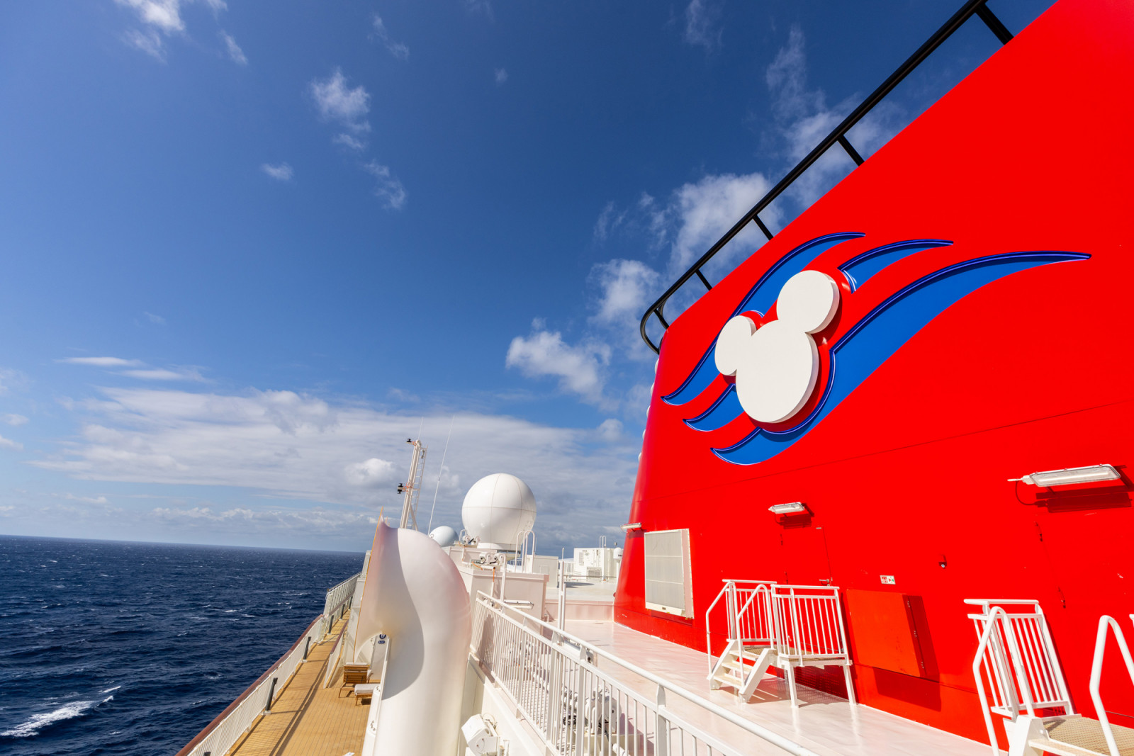 With its trademark iconic red funnels, the Disney Adventure is the newest addition to the expanding Disney Cruise Line fleet and the first for families in Asia. (Preston Mack, photographer)