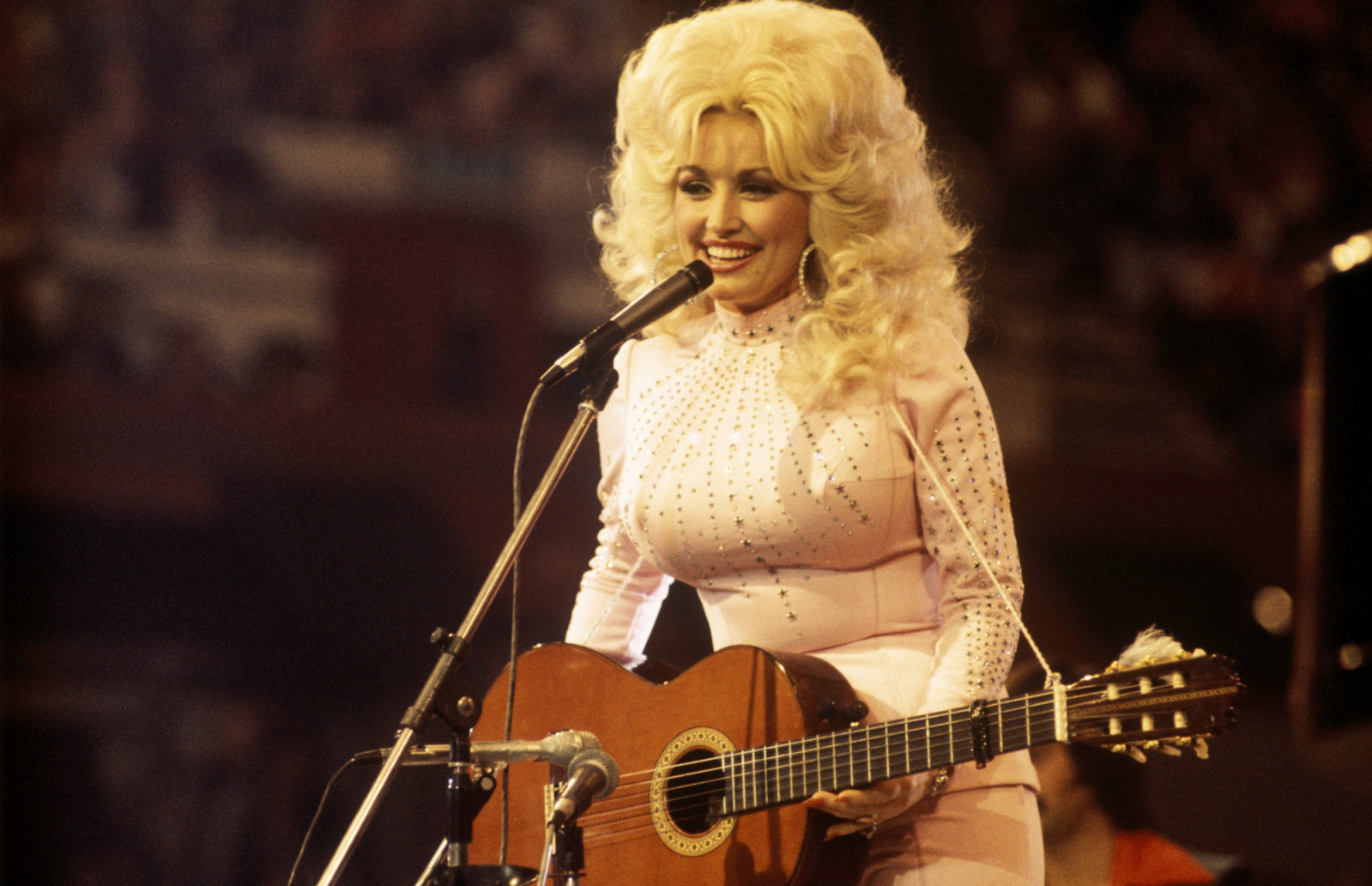 Dolly Parton’s seven-decade career as a singer-songwriter and philanthropist set a benchmark for artistic autonomy and women’s empowerment in the entertainment industry. (Photo: Getty Images)