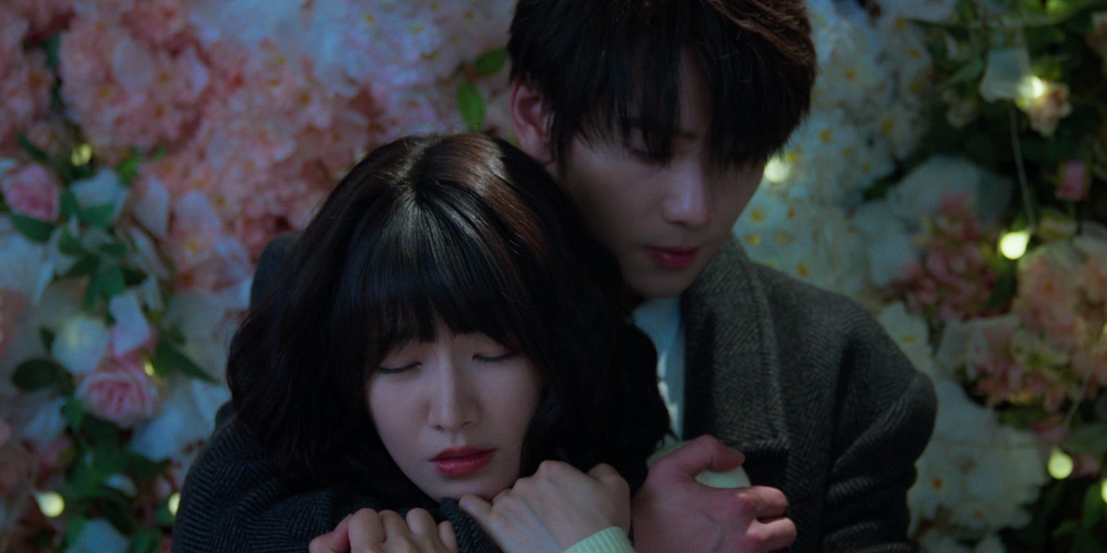Two Chinese actors hugging in front of a flower backdrop for C-drama Affinity (Photo: Rakuten Viki)