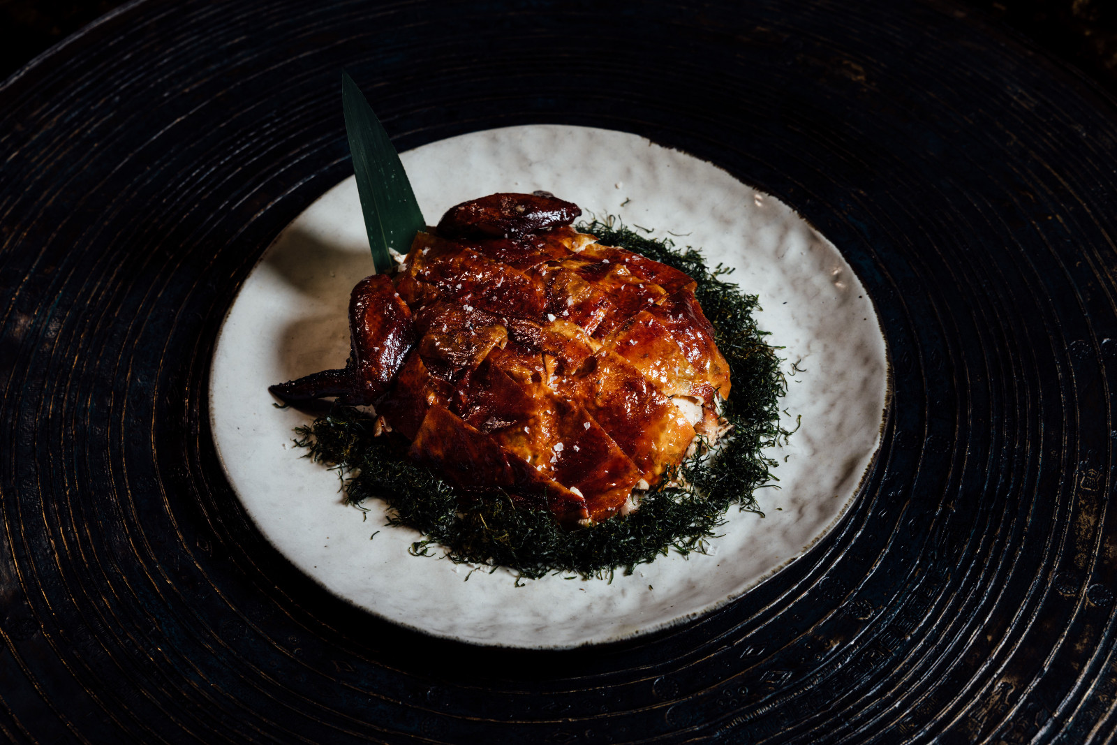 Grilled hand-shredded chicken with black truffle at Mott 32 Cebu