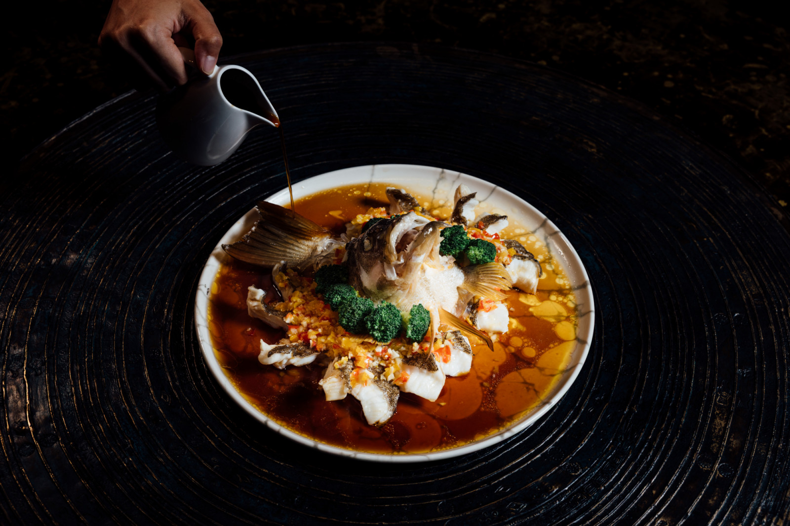 Steamed grouper with homemade yellow bell pepper sauce at Mott 32 Cebu
