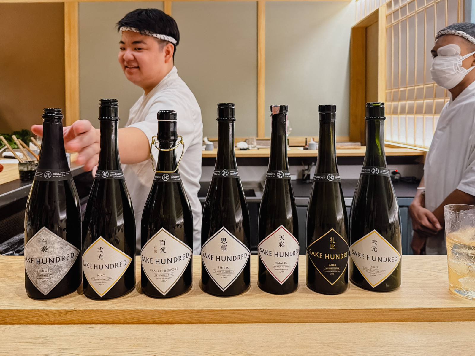 SAKE HUNDRED bottles at the Torisawa 22 counter