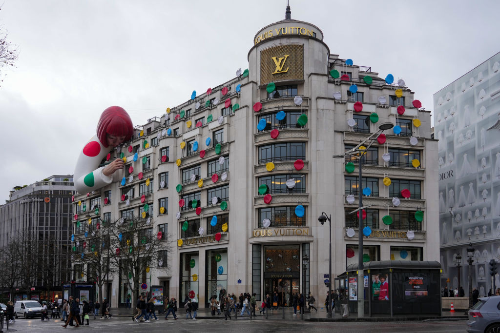 PARIS, FRANCE - JANUARY 12: A Yayoi Kusama sculpture is displayed on the top of the Louis Vuitton's Champs Elysees store, on January 12, 2023 in Paris, France. This Year the French Fashion house has launch a second collaboration with Yayoi Kusama.The first one was in 2012. The Yayoi Kusama x Louis Vuitton collection are now available in all Louis Vuitton's Stores Worldwide. (Photo by Edward Berthelot/Getty Images)