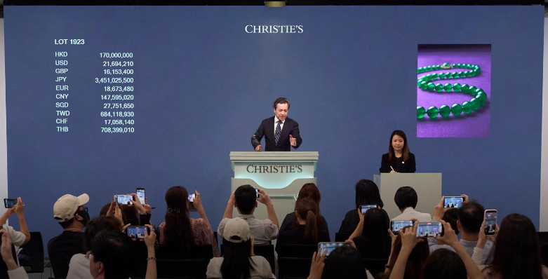 Rahul Kadakia, President of Christie’s Asia Pacific and Chairman of the Global Luxury Group auctioning 'The Ethereal Jadeite Necklace' in Hong Kong , the most valuable masterpiece sold in Asia this Spring, for HK$200,200,000 / US$25,548,143