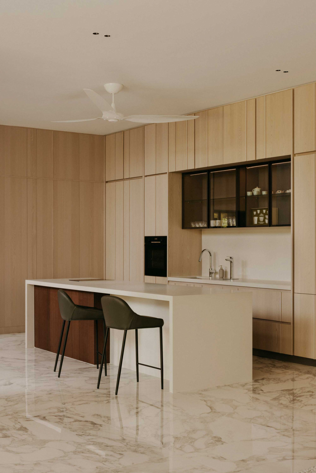The dry kitchen and bar area feels unhurried thanks to its soothing palette of neutrals