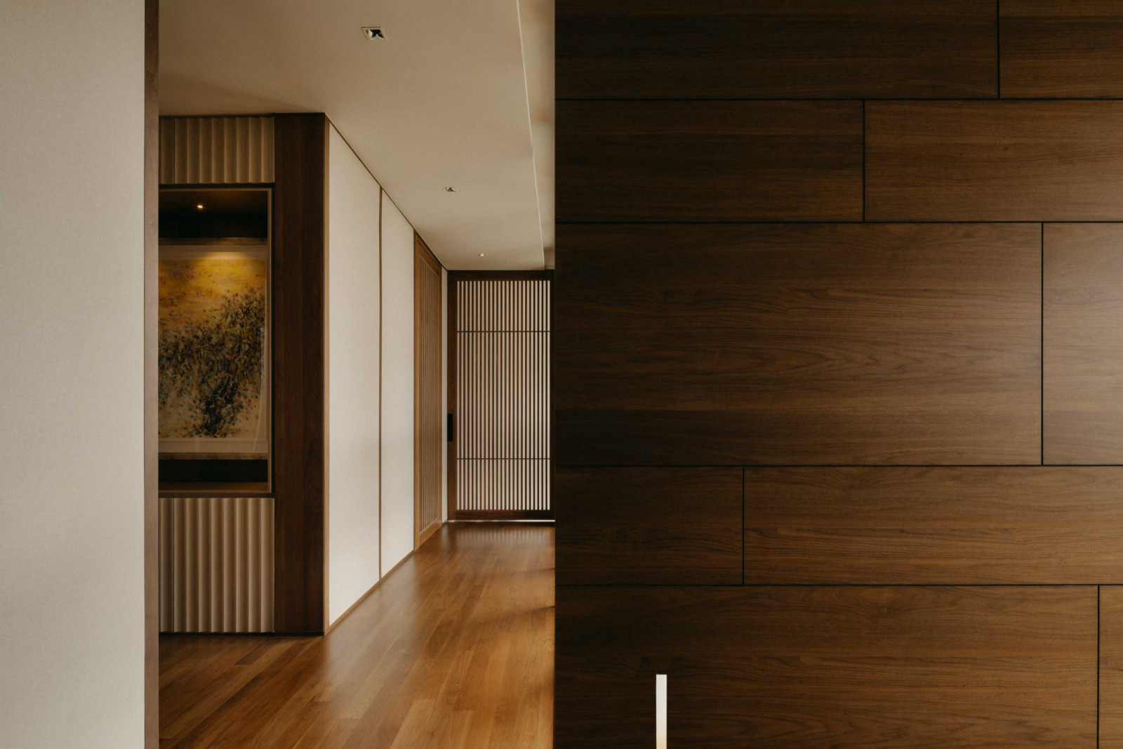 Wood motifs paired with natural walnut flooring tie back to the nature-filled theme of Evergreen House