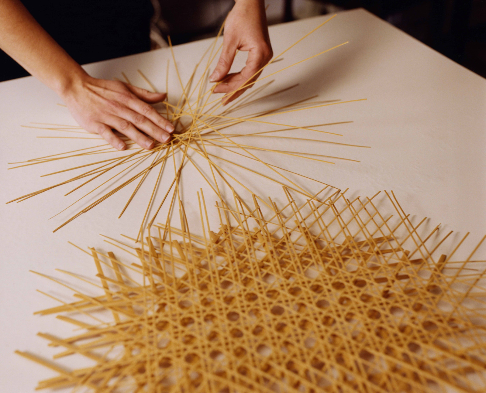 A close-up of the bamboo lamp being crafted by a Kyoto artisan