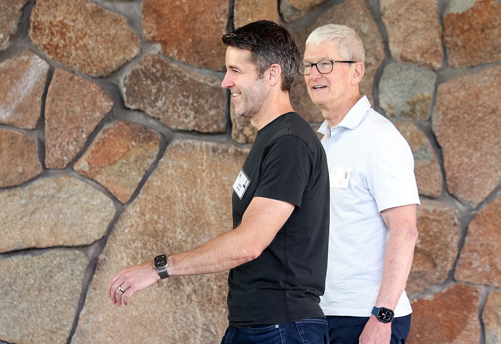 SUN VALLEY, IDAHO - JULY 07: Tim Cook (R), CEO of Apple, walks with John Ternus, incoming CEO of Apple, arrive at the Allen & Company Sun Valley Conference at the Sun Valley Lodge on July 7, 2026 in Sun Valley, Idaho. Every year, some of the world's wealthiest and most powerful figures from the media, finance, technology, and political spheres converge at the Sun Valley Resort for the exclusive week-long conference hosted by boutique investment bank Allen & Co. (Photo by Kevin Dietsch/Getty Images)