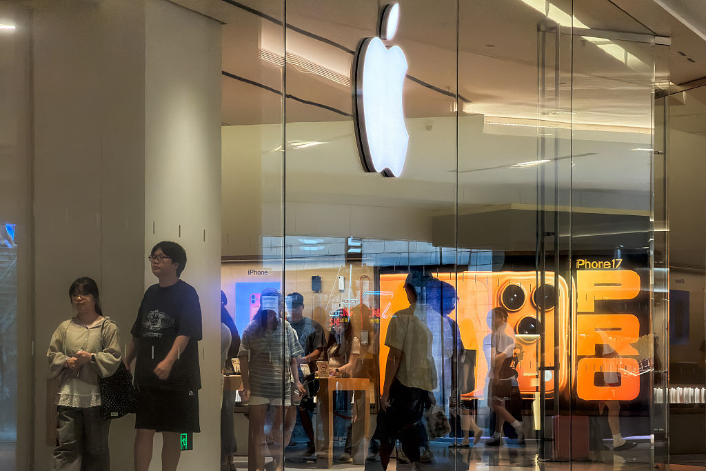 SHENZHEN, CHINA - AUGUST 29: An illuminated Apple logo and an advertisement for the iPhone 17 Pro are seen as customers shop inside an Apple retail store on August 29, 2026, in Shenzhen, Guangdong Province, China. Apple is preparing to unveil its next-generation iPhone lineup in September as the technology company navigates intensifying smartphone competition and seeks to strengthen its artificial intelligence offerings in the strategically important Chinese market. (Photo by Cheng Xin/Getty Images)