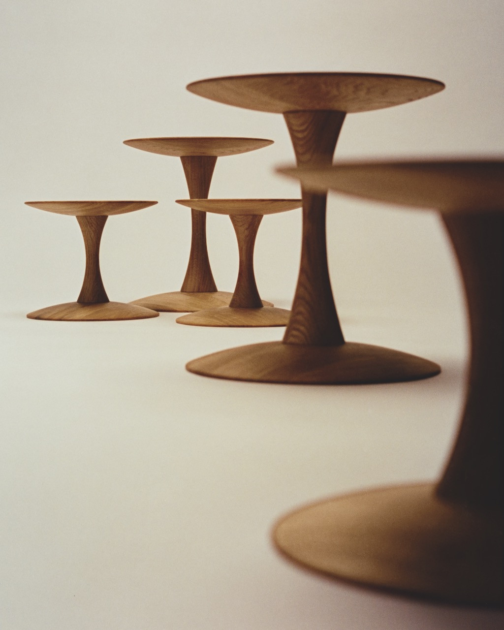 Nanna Ditzel’s 1962 Trisse stools and tables reissued in FSC-certified solid oak, by Fredericia