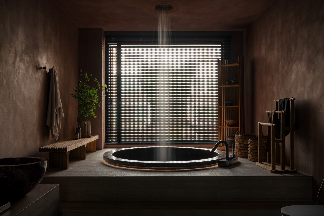 The same bathtub viewed from across the room, with woven baskets and a teak shelving unit visible against the window