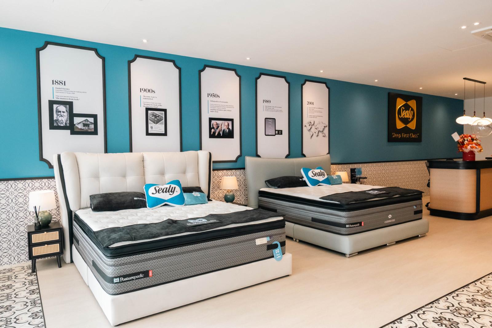 The ground-floor heritage wall traces Sealy’s story from 1881 to the present, framed against a nautical blue backdrop and flanked by the brand’s Posturepedic display beds
