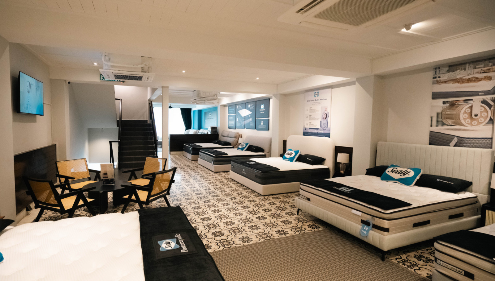 The first floor showcases the Elevate range, where patterned Peranakan-inspired flooring is the backfdrop of the seating area for customers to pause between mattress trials