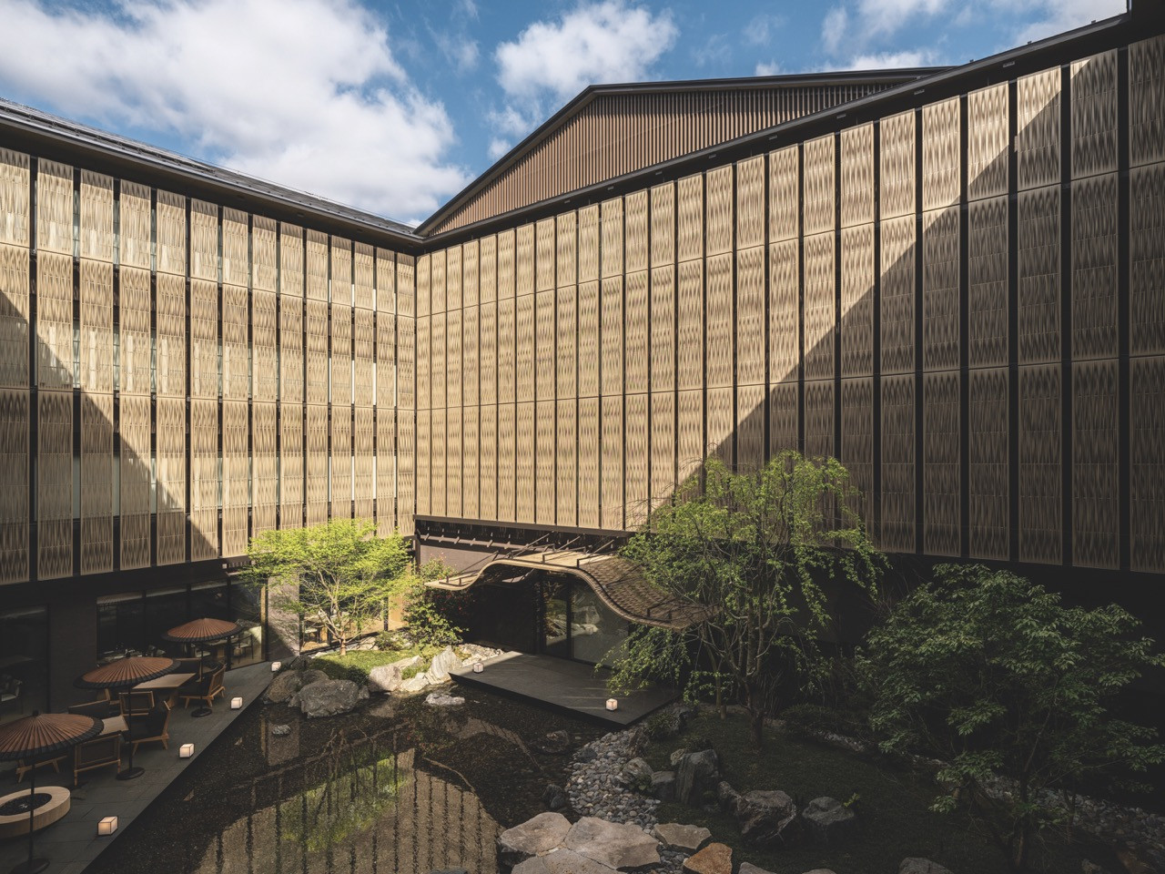 The tsuboniwa courtyard garden, enclosed by Kengo Kuma and Associates’ woven-screen facade