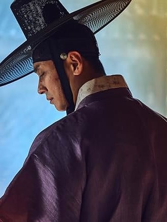 Ju Ji-hoon as Crown Prince Lee Chang battling zombies in the Joseon-era horror series Kingdom