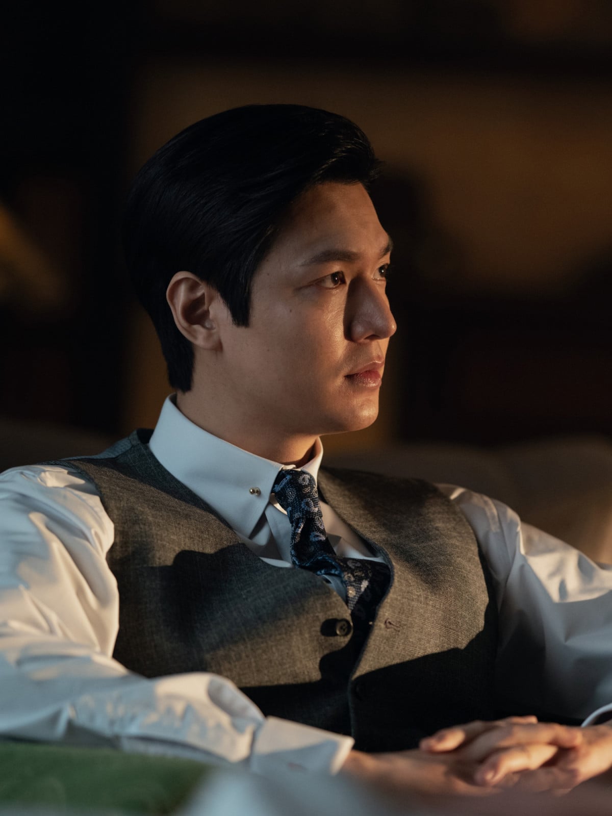 Lee Min-ho looking stern as businessman Koh Han-su in the Apple TV Plus period drama Pachinko